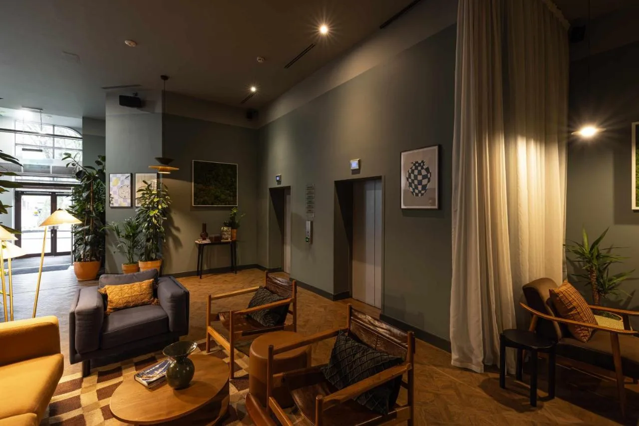 a living room with a couch and a table at Cove Minshull Street in Manchester