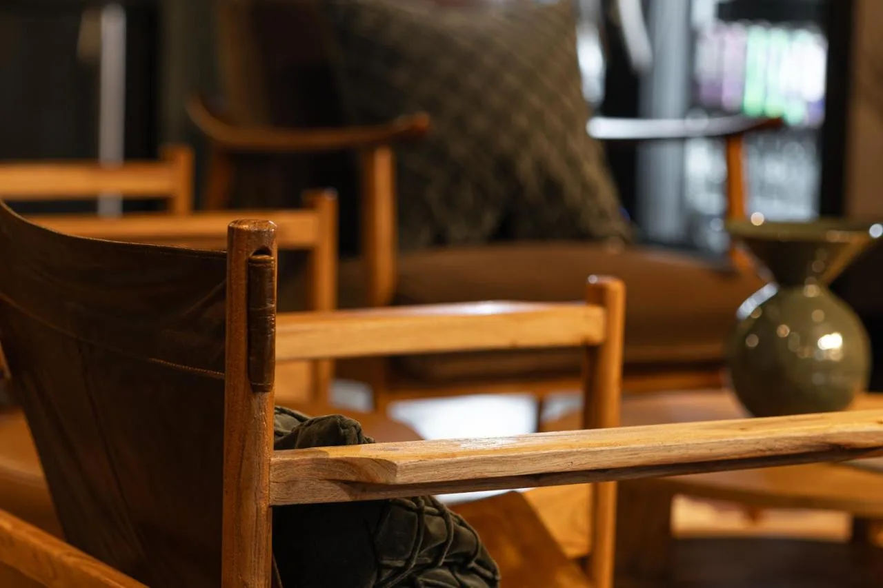 a group of chairs and a couch in a room at Cove Minshull Street in Manchester
